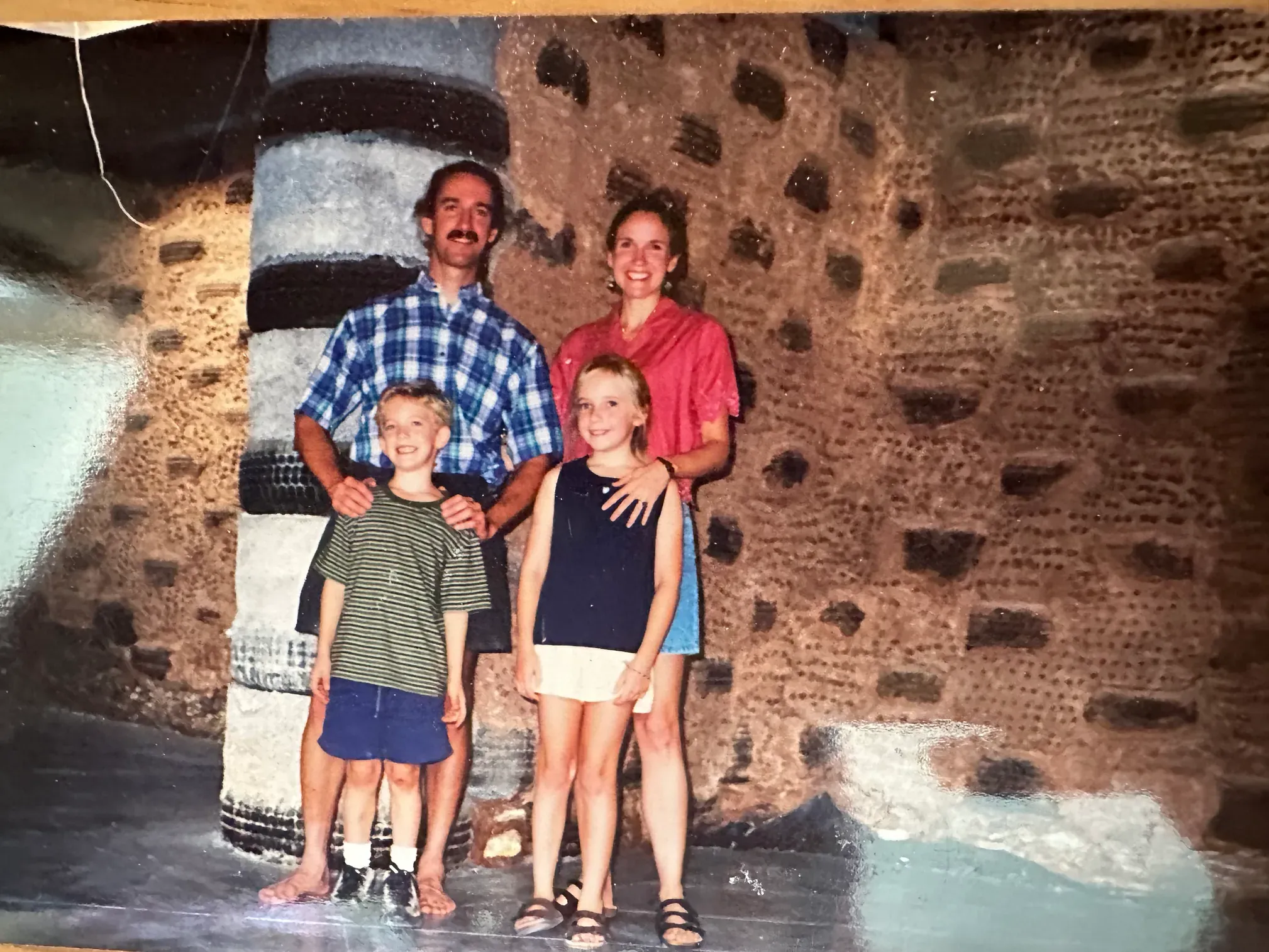 The Reed family in 1999 in front of the tire wall of the earthship Josh grew up in