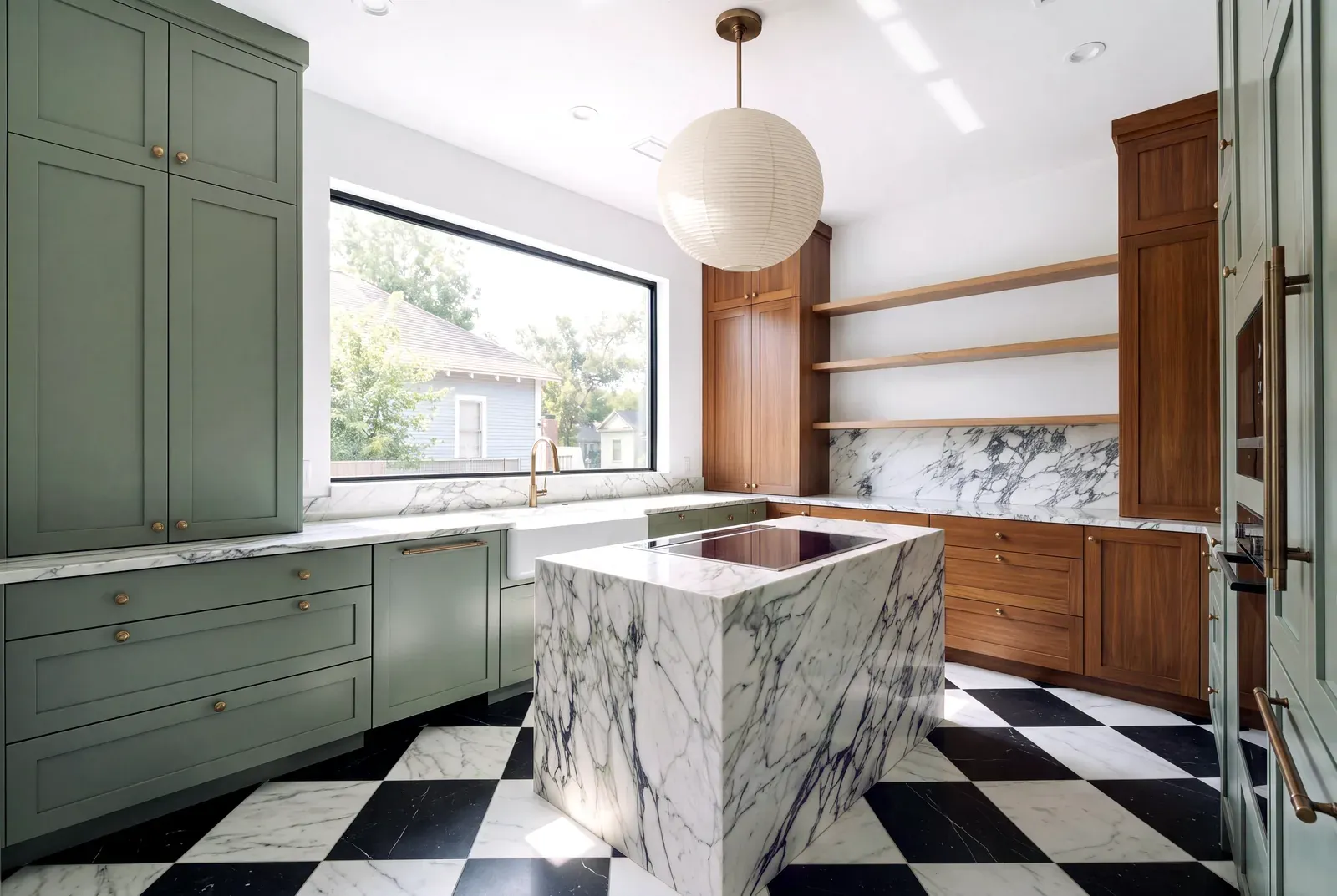 Remodeled kitchen with sage green cabinetry, walnut uppers, a marble waterfall island and a black and white checkerboard floor